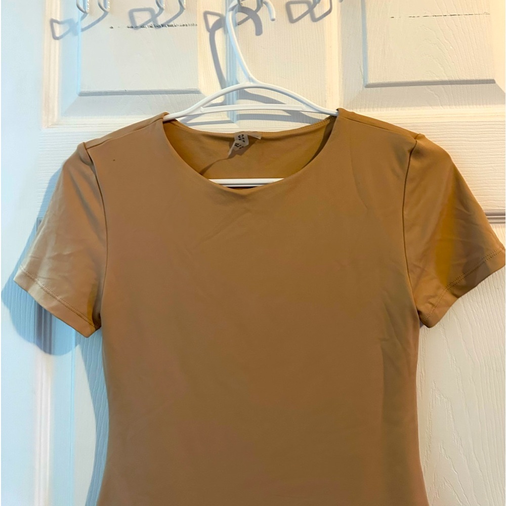 “Versatile Bodysuit with a T-Shirt Look”